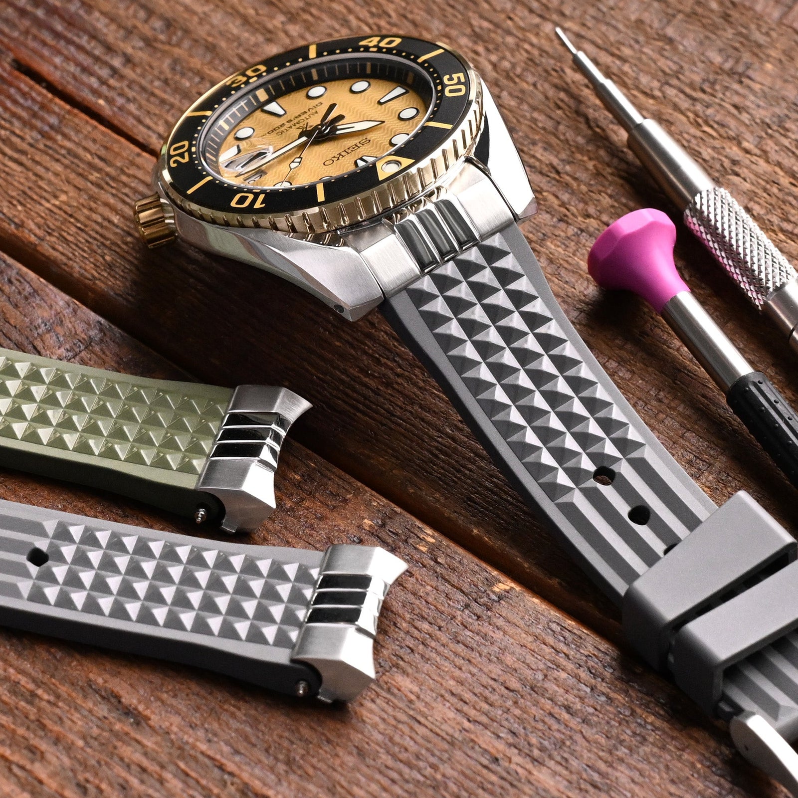 A Watch with a grey watch strap